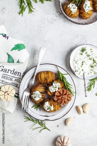Photos Baked potatoes with rosemary and garlic.
