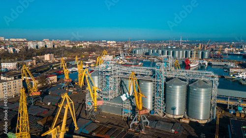 Industrial port in the field of import-export global business logistics and transportation, Loading and unloading container ships, cargo transportation from a bird's eye view.