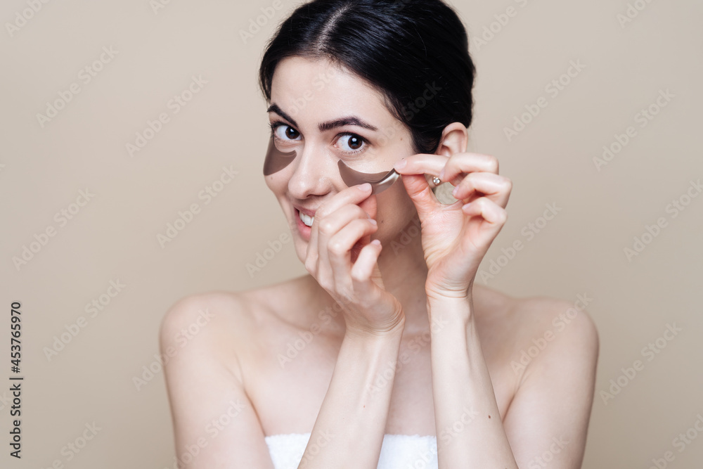 Eye patch, Beautiful Woman With Natural skin And Green Hydro Gel Eye Patches under her eyes. Caucasian woman use patches after shower, skin care Eye patch, Beautiful Woman With Natural skin And Green Hydro Gel Eye Patches under her eyes. Caucasian woman use patches after shower, skin care