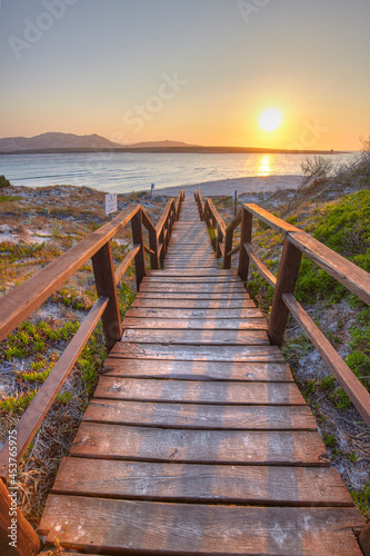 Footbridge to the beach of La Pelosa in Stintino, Sardinia, Italy photo