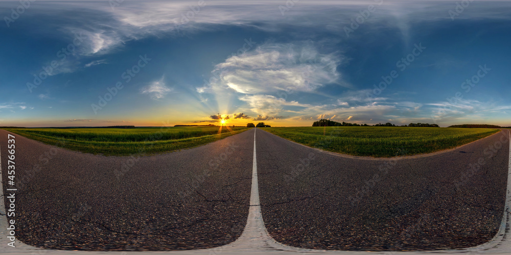 hdri seamless spherical 360 panorama on asphalt road among fields in summer evening sunset with awesome clouds in equirectangular projection, ready for VR AR virtual reality
