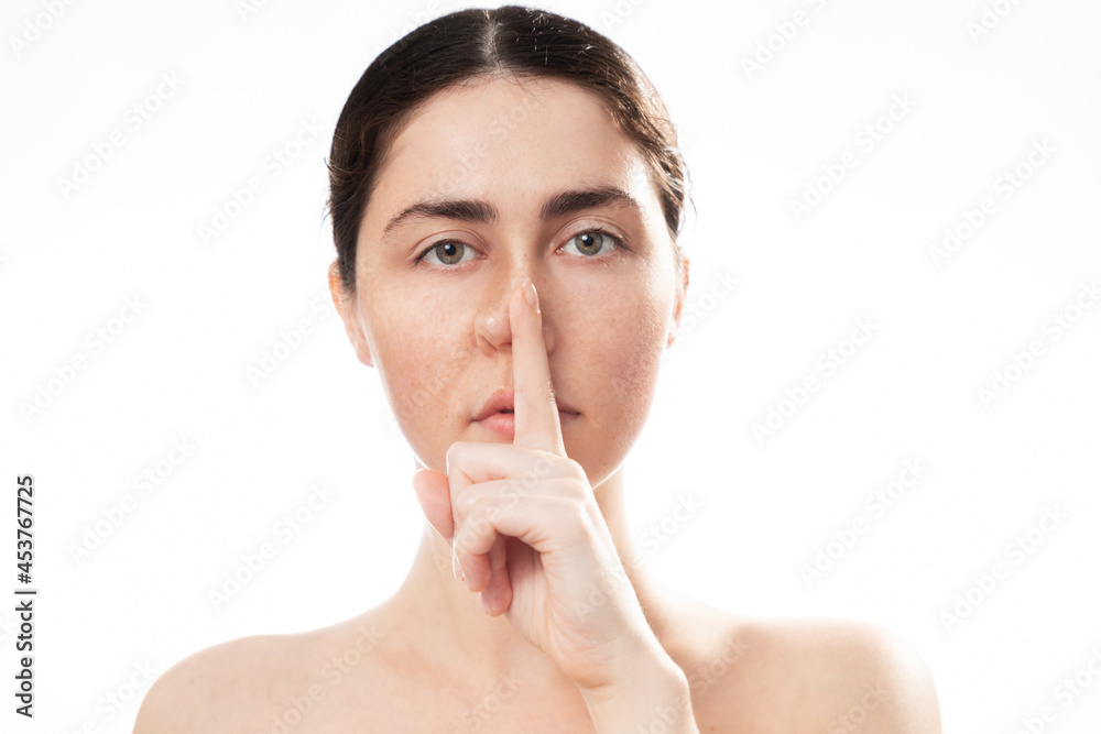 Plastic nose surgery. Portrait of young caucasian woman touching her crooked nose isolated on white background. Concept of rhinoplasty Plastic nose surgery. Portrait of young caucasian woman touching her crooked nose isolated on white background. Concept of rhinoplasty