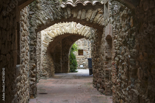 Beautiful narrow street in Peratallada, Catalonia, Spain photo