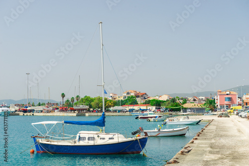 boats sway on the turquoise waves of the Ionian sea of Greece in sunny weather