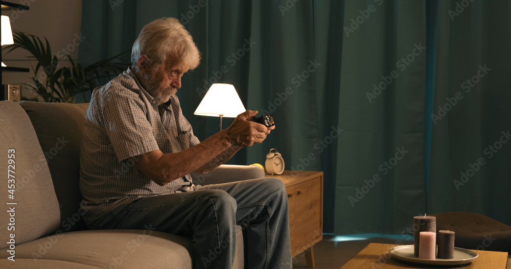 Senior man playing video games Senior man playing video games