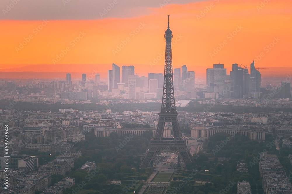 View from montparnasse tower at sunset over the city streets of Paris, France