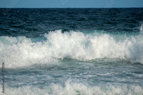 turquoise waves crashing at the beach
