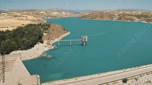 Drone dam blue lake azure turquoise waters in desert wilderness area in Cyprus. Asprokremmos reservoir on lake in mountain suburb region. Wild nature landscape. Environment save. Eco tourism. photo