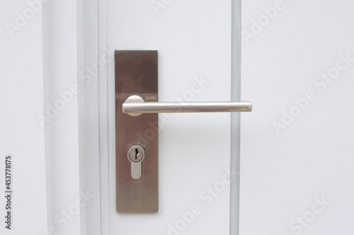 Modern house door handle and key slot.