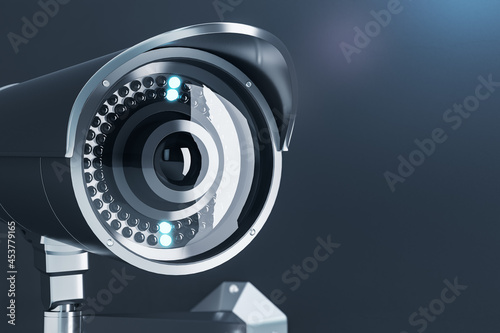 Close up of cctv camera on gray background with mock up place for your text and advertisement. Control system concept. 3D Rendering.