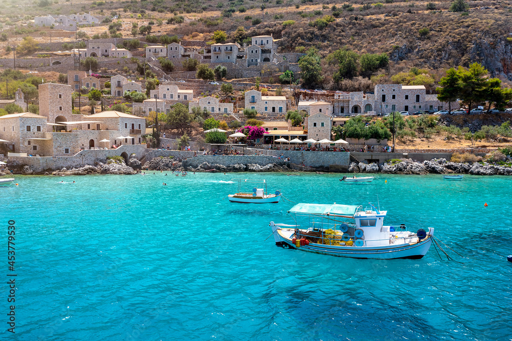 The idyllic fishing village of Limeni on the south Mani coast, Peloponnese, Greece, with turquoise sea during summer time