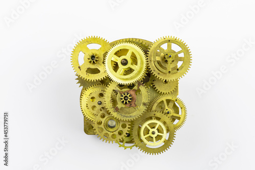 The old mechanism of bronze gears insulated on a white background.