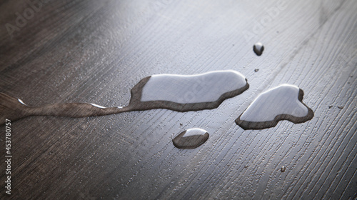 Принти на полотні Drops of water on laminate floor.