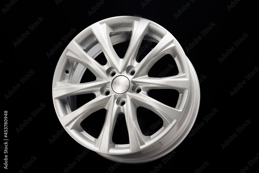Obraz premium alloy wheel close-up. New modern auto parts, black background