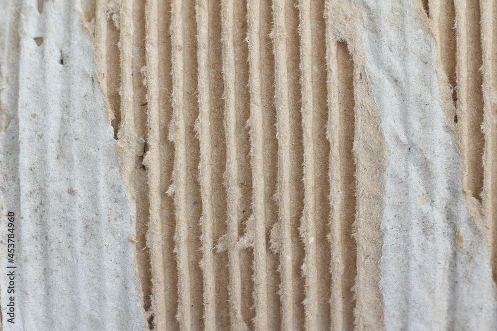 Corrugated torn cardboard paper background.