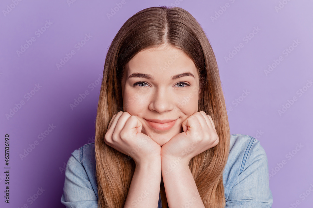 Close up photo of adorable lovely girl hands face on violet background Close up photo of adorable lovely girl hands face on violet background