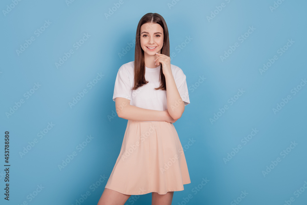 Portrait of dreamy adorable stunning lady finger chin think on blue background Portrait of dreamy adorable stunning lady finger chin think on blue background