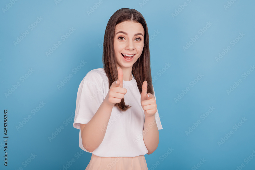 Portrait of excited crazy friendly cheerful nice lady forefingers direct camera on blue background Portrait of excited crazy friendly cheerful nice lady forefingers direct camera on blue background