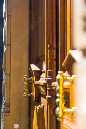 vertical shot of vintage door handles at golden hour photo