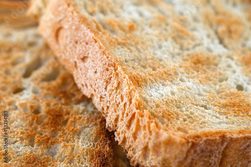 Croutons or bread toasts close-up macro view fried on grill