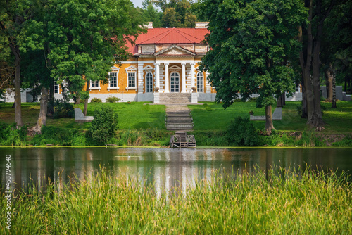 Scenic view of ancient palace and old park reflected in the water of pond, Samchyky, Khmelnytskyi region, Ukraine © haidamac