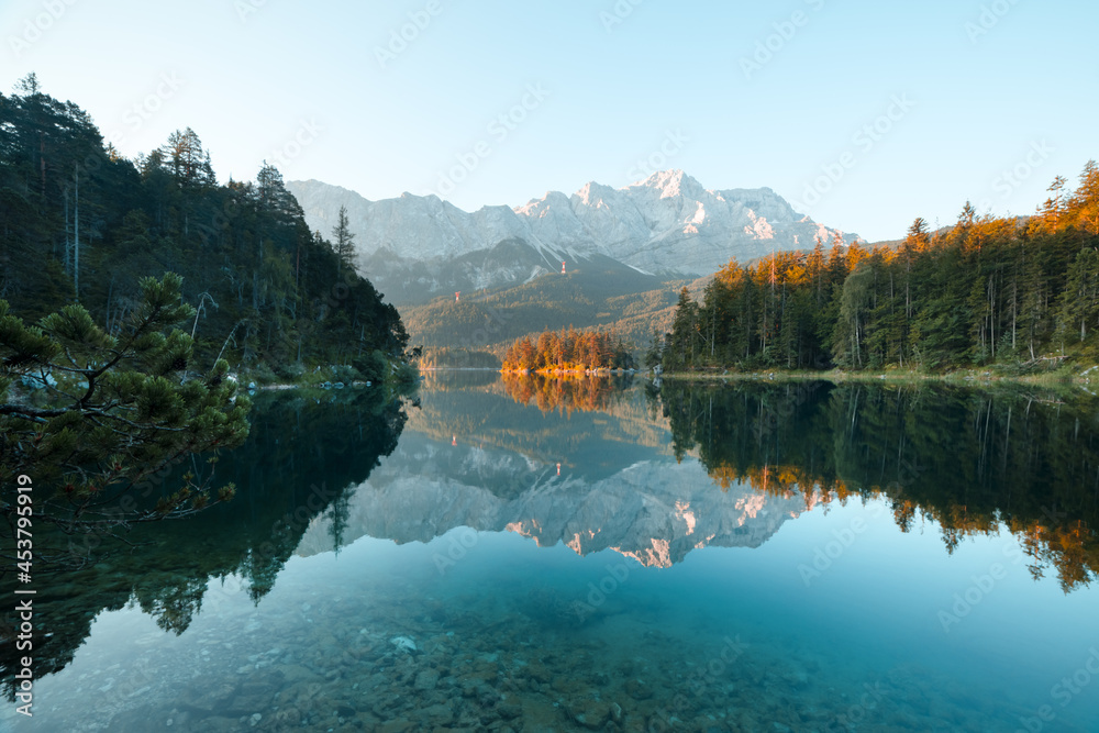 Naklejka premium Fantastic morning on mountain lake Eibsee, located in the Bavaria, Germany. Dramatic unusual scene. Alps, Europe. Landscape photography
