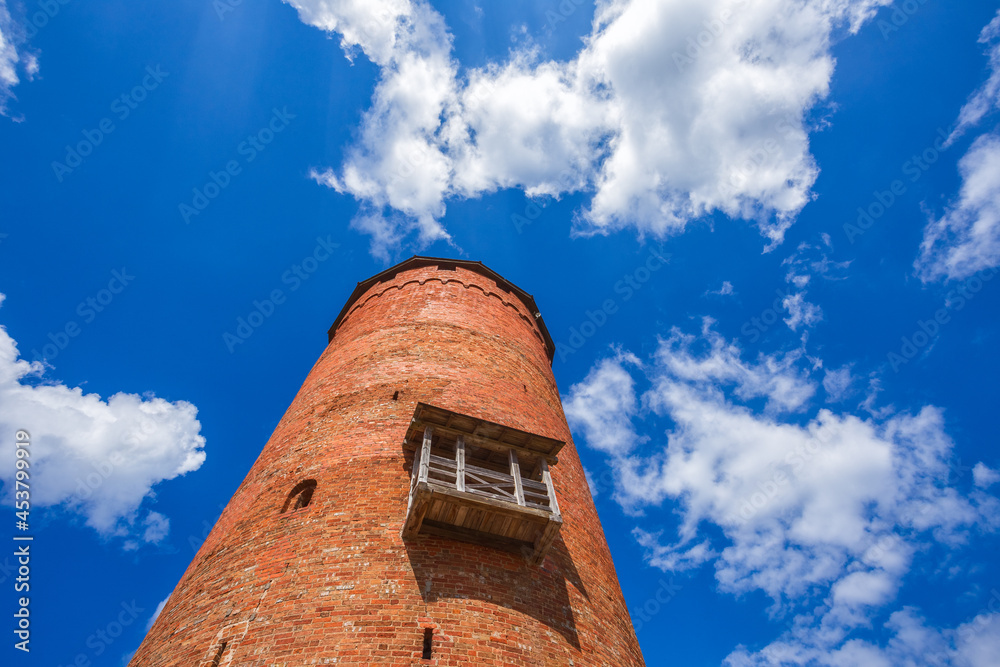 Old Turaida castle tower in a sunny day. Summer landscape. Gauja national park, Sigulda, Latvia Old Turaida castle tower in a sunny day. Summer landscape. Gauja national park, Sigulda, Latvia
