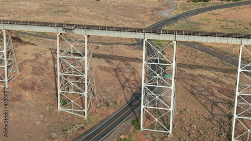 Aerial: Joso High Bridge, a railway bridge crossing the Snake river. In the background is Lyons Ferry State Park, Washington, USA photo