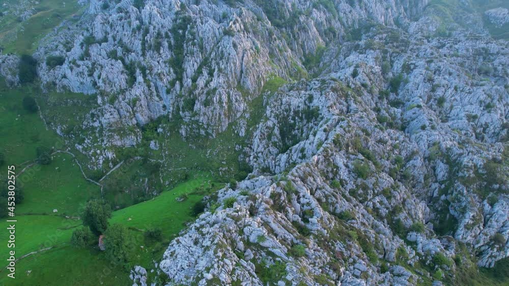 Landscape of Mountains, karst, meadows, forests and huts in the surroundings of Puerto de los Machucos between Bustablado and San Roque de Riomiera. Montañas del Pas, Cantabria, Spain, Europe Landscape of Mountains, karst, meadows, forests and huts in the surroundings of Puerto de los Machucos between Bustablado and San Roque de Riomiera. Montañas del Pas, Cantabria, Spain, Europe
