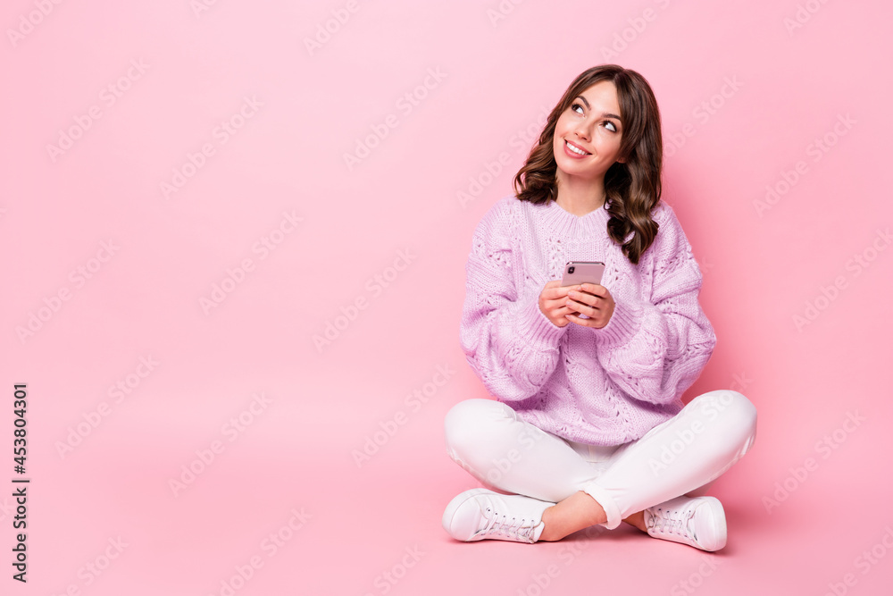 Portrait of pretty creative minded cheerful girl using device creating post copy space isolated on pink pastel color background Portrait of pretty creative minded cheerful girl using device creating post copy space isolated on pink pastel color background