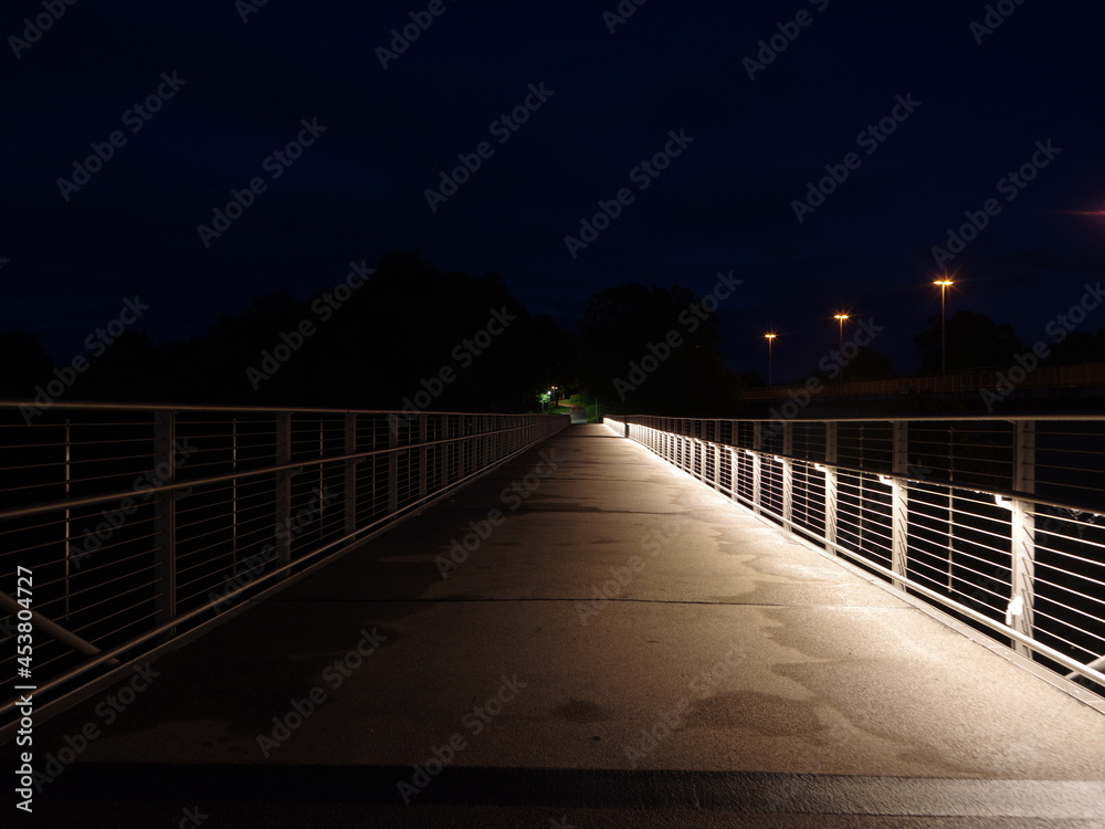 pedestrian bridge with drive at night