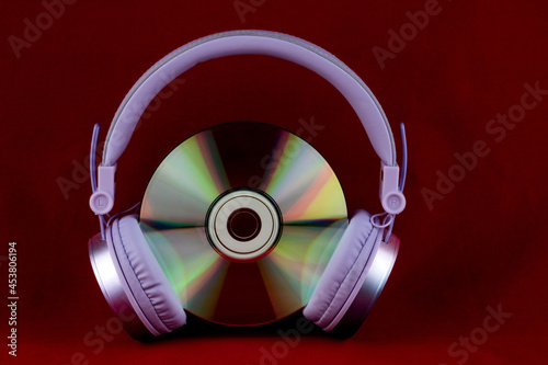 Headphones and CD on a Red Background