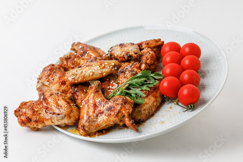 Chicken Wings On Levitation Plate Isolated On White Background. Side View.