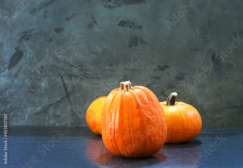Orange pumpkin on a grey background
