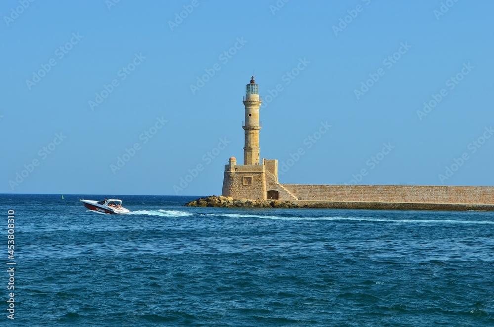 lighthouse in the old harbor of Chania, Crete, Greece