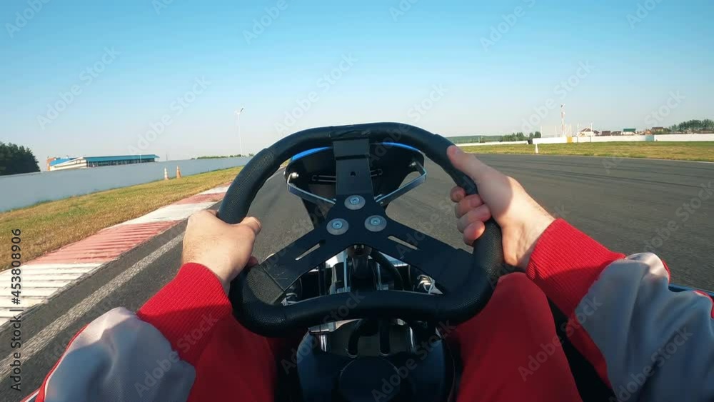 Driver at the wheel of a car while racing on the track