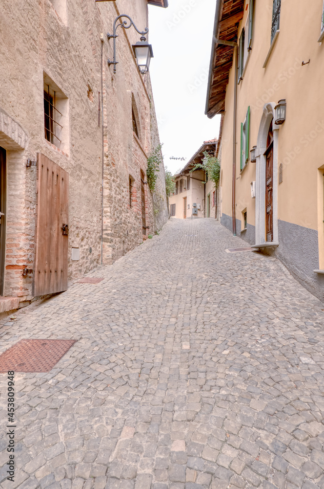 Old street of Monforte d'Alba, typical medieval village in the hilly region of Langhe (Piedmont, Northern Italy), UNESCO site since 2014.