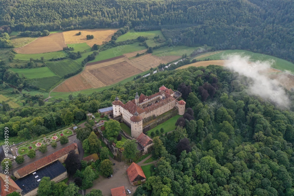 Aerial drone shot of Langenburg Castle in Langenburg, Germany on a misty afternoon