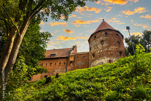 Defense walls and tower of medieval gothic Bytow Castle of Teutonic Order and Pomeranian Dukes in historic city center in Poland photo