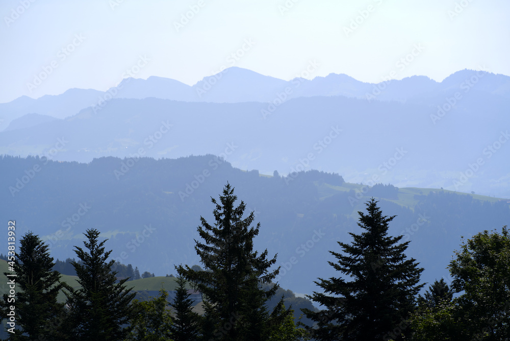 Beautiful scenic mountain panorama seen from local mountain Pfänder on a sunny summer day. Photo taken August 15th, 2021, Bregenz, Austria.