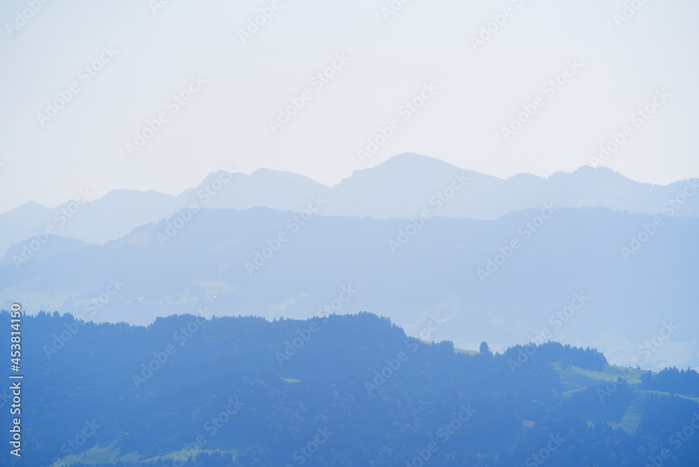 Beautiful scenic mountain panorama seen from local mountain Pfänder on a sunny summer day. Photo taken August 15th, 2021, Bregenz, Austria.