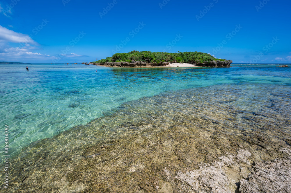 Bise Beach, Cape Bisezaki, Okinawa, Japan. A pristine beach on the main island of Okinawa with clear water and a beach reef Bise Beach, Cape Bisezaki, Okinawa, Japan. A pristine beach on the main island of Okinawa with clear water and a beach reef