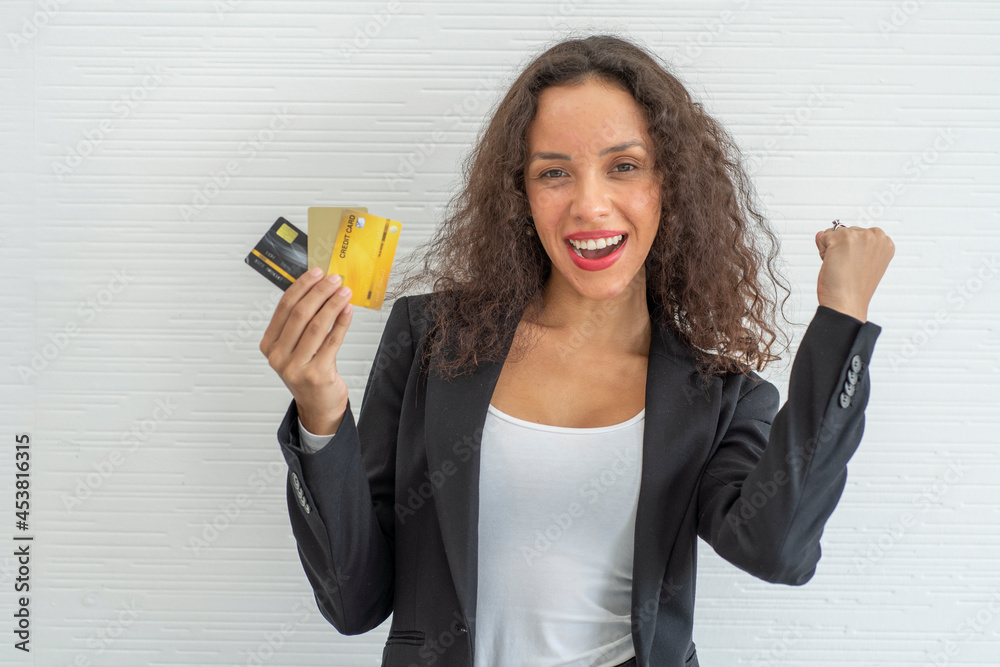 A South American Latino woman with a credit card has the power to spend money and the credit to apply for a credit to shop online happily.
A South American Latino woman with a credit card has the power to spend money and the credit to apply for a credit to shop online happily.