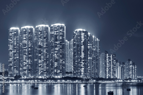 High rise residential building in Hong Kong city at night © leeyiutung