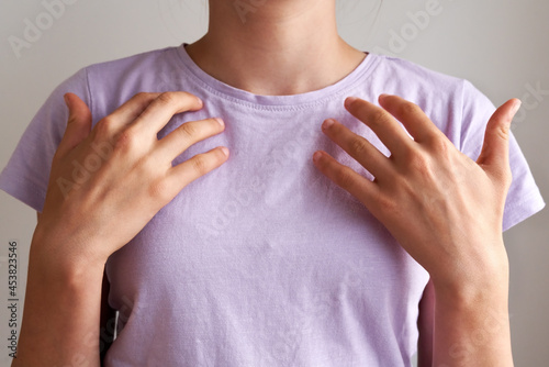 Teenager practicing EFT tapping - emotional freedom technique photo