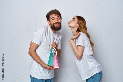 Wallpaper Mural young couple with colorful bags holiday gifts friendship Torontodigital.ca