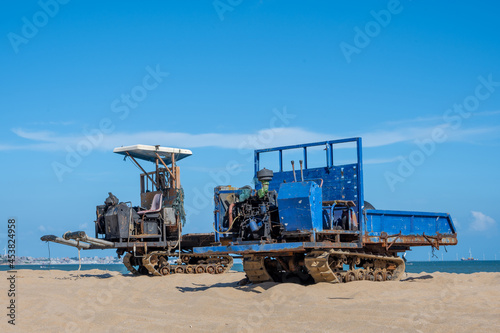 Old fishing machines parked on the beach