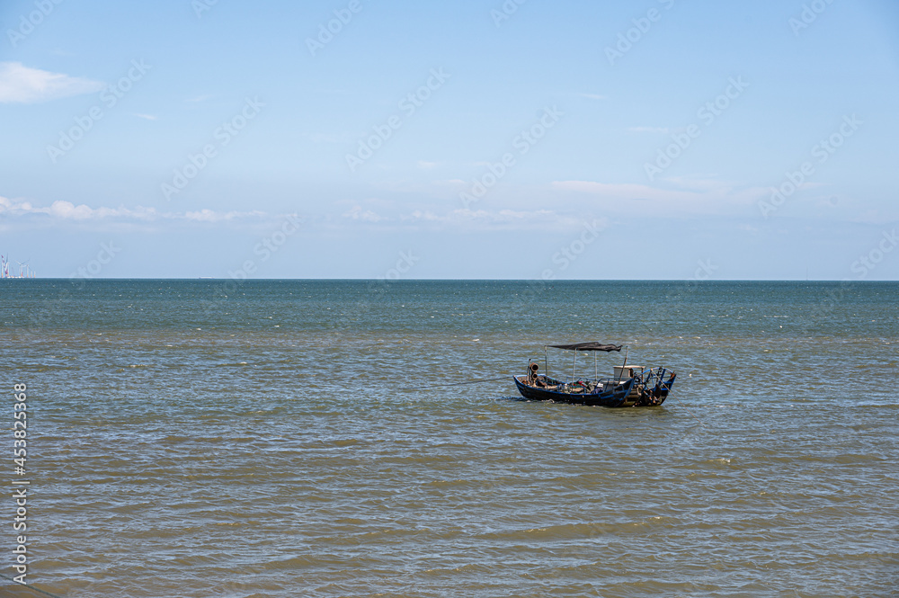 On a sunny day in summer, the speedboat drove fast in the blue sea On a sunny day in summer, the speedboat drove fast in the blue sea