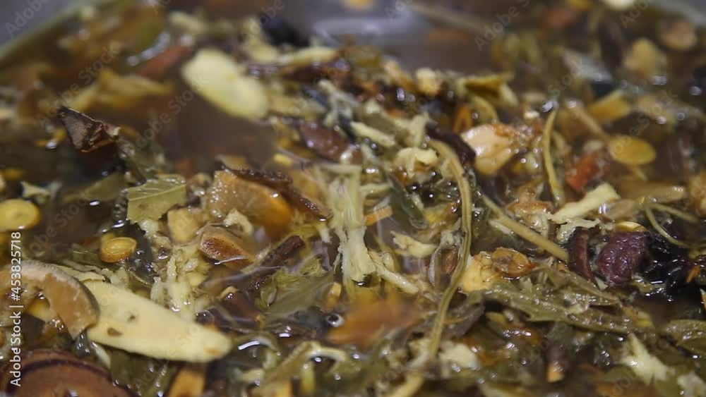 chinese herbs Chinese herbal medicine derived from nature for example, mushrooms, roots, leaves in boil in the pot . chinese herbs Chinese herbal medicine derived from nature for example, mushrooms, roots, leaves in boil in the pot .