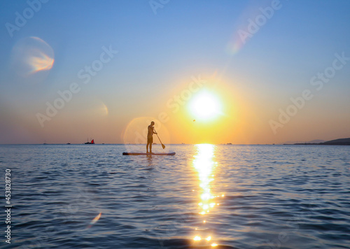 sup surfing in the sea © yanlev